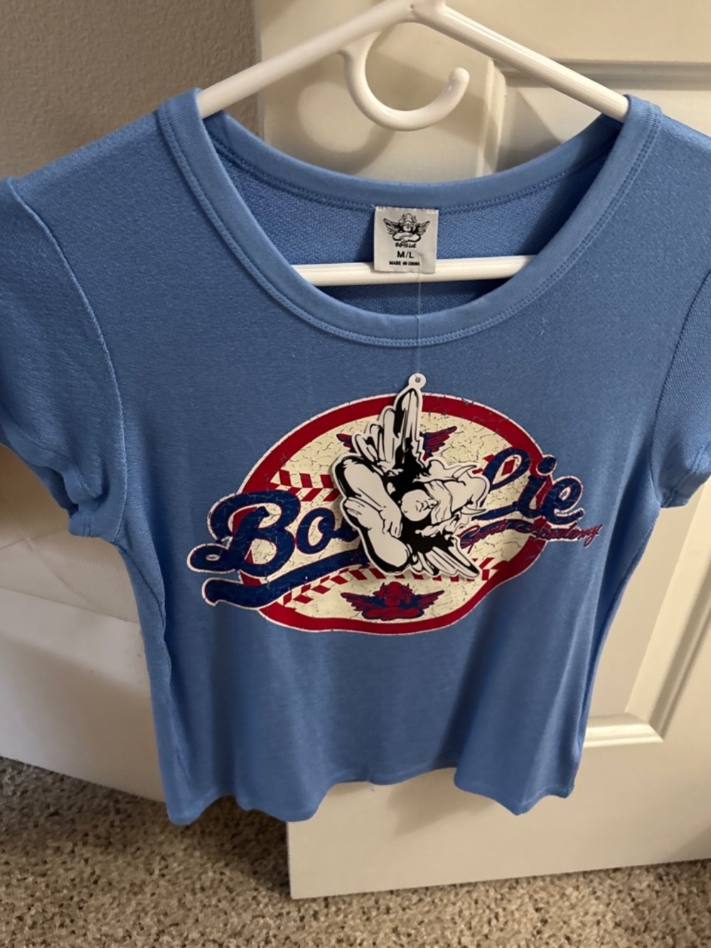 Boys low women’s T-shirt brand new with the tag size medium large